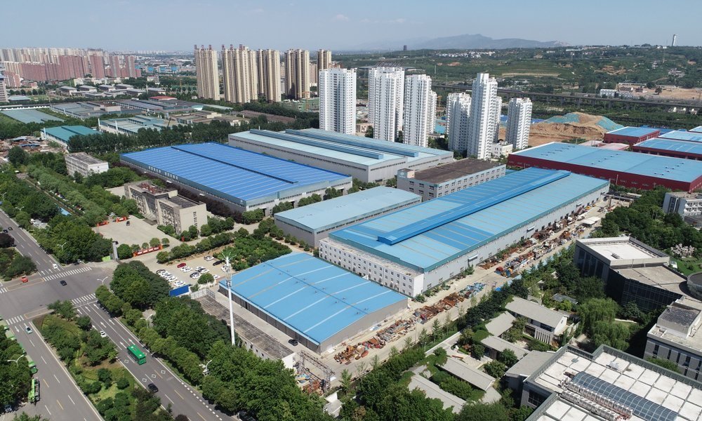 Aerial view of the manufacturing base with production halls and finished-machine stockyard