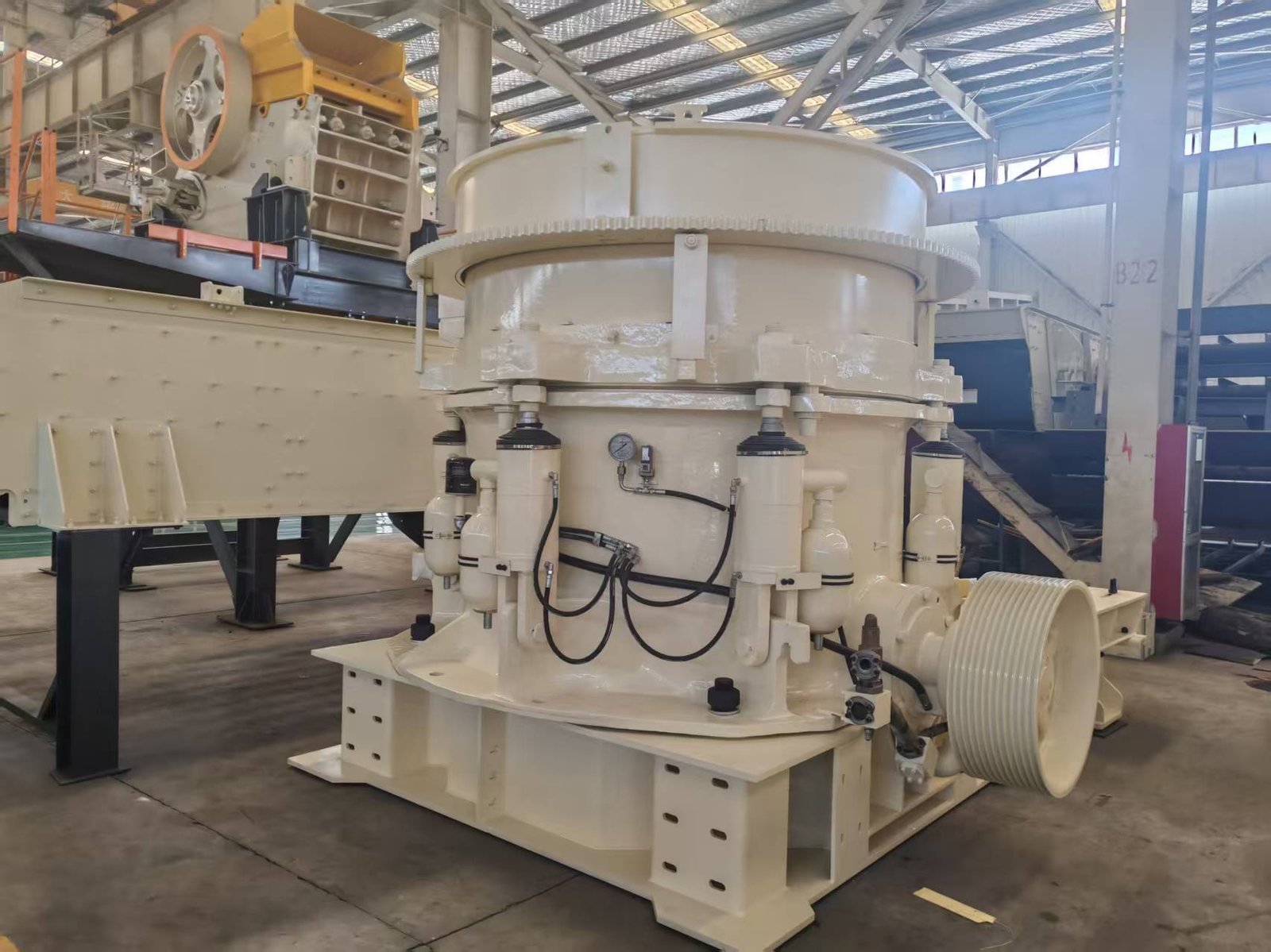 Cone crusher being prepared for shipment on the workshop floor